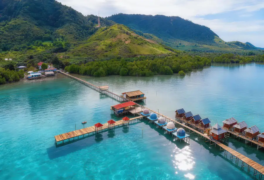 Aerial drone view of the overwater resort deck Turtle Garden Resort