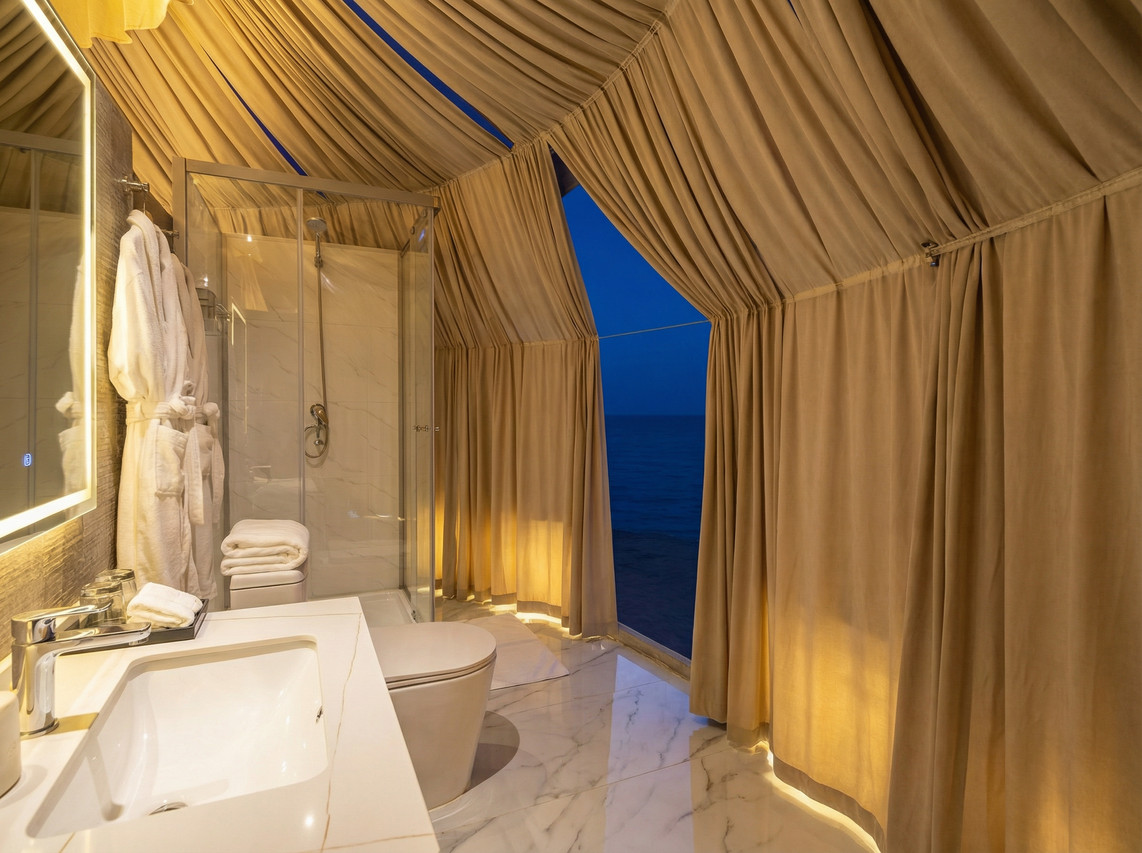 Glamping-style bathroom with sea view Turtle Garden Resort