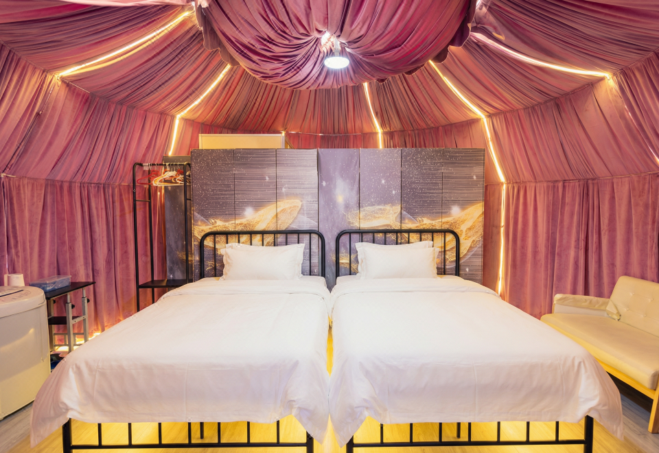 Pink dome twin room interior Turtle Garden Resort