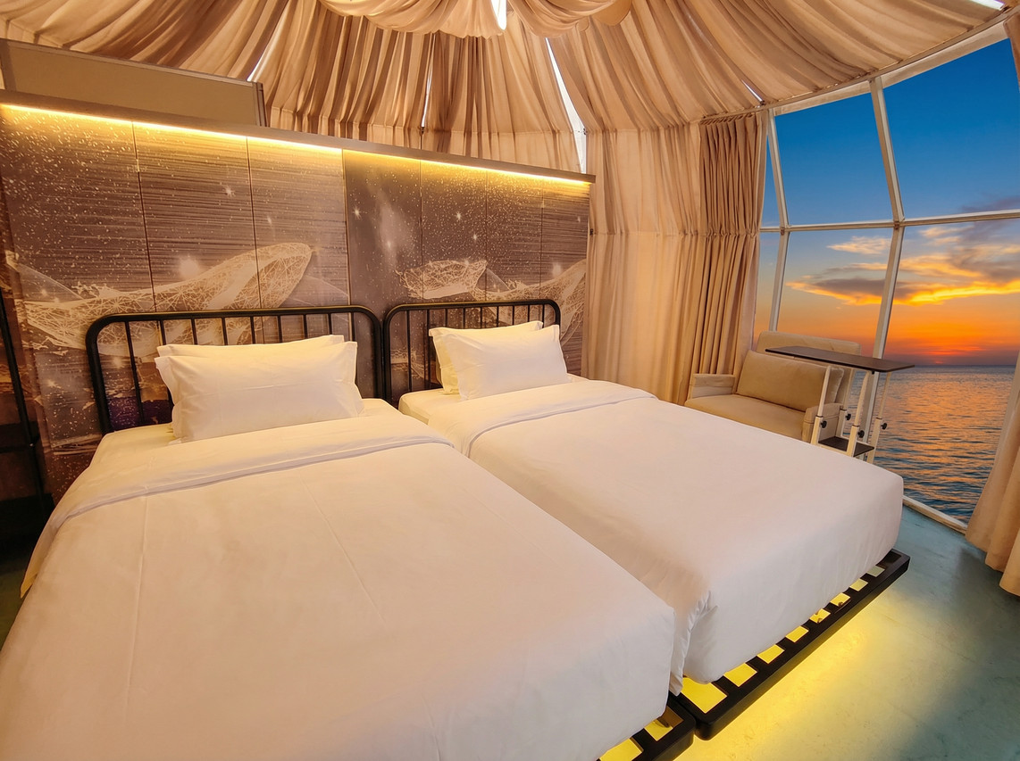 Sunset view through dome twin bedroom Turtle Garden Resort